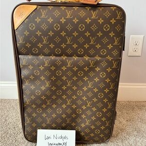 Louis Vuitton Pegase 55 with LV tag and garment bag accessory